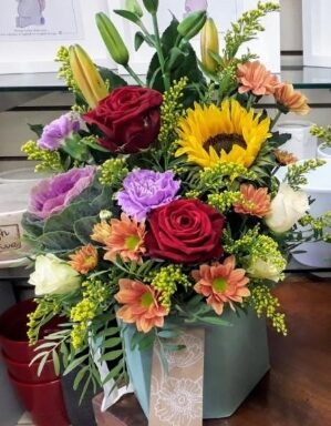 a bouquet of flowers in a box