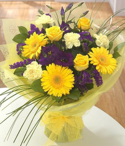 a bouquet of yellow and purple flowers