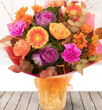 a bouquet of flowers in a glass vase