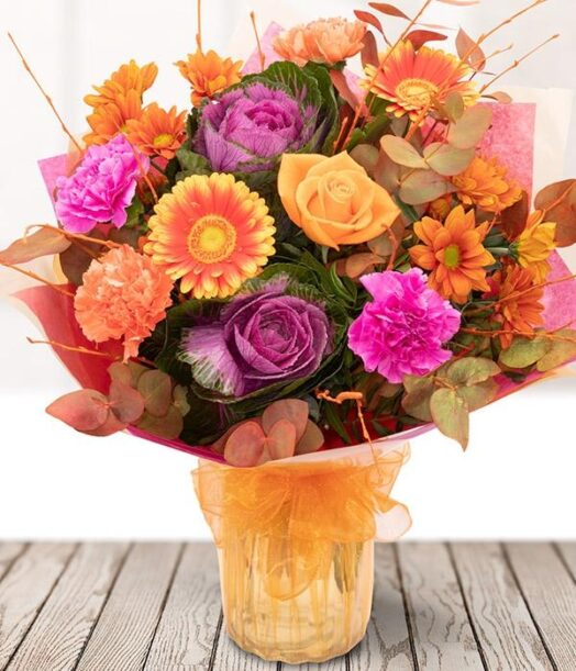 a bouquet of flowers in a glass vase