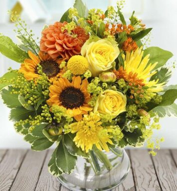 a bouquet of flowers in a glass vase