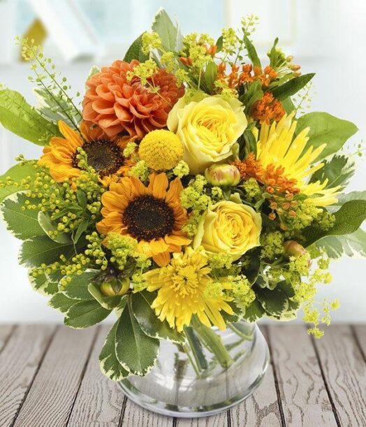 a bouquet of flowers in a glass vase